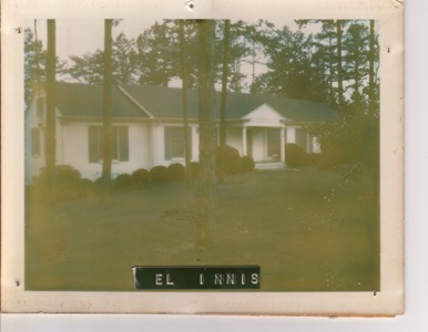 El Innis home, white one-story