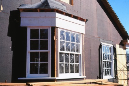 window frames set in place in the wall fo the house